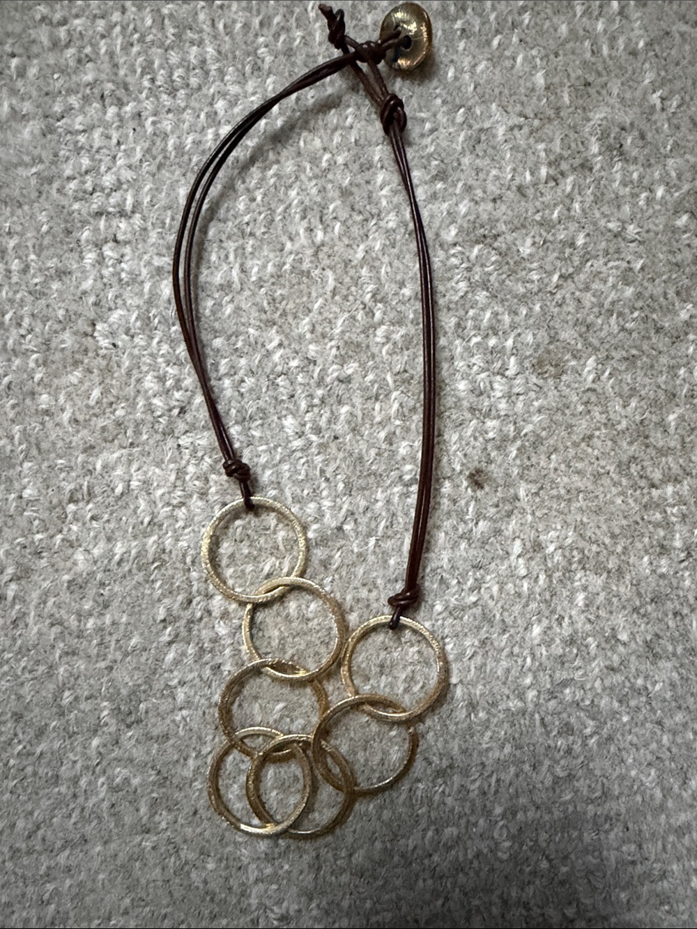 IN2 Designs Gold Multi-Ring Pendant Necklace on Brown Cord